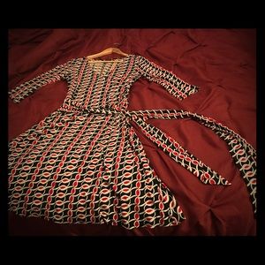 Black white and red long-sleeved wrap dress.